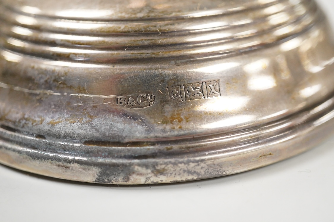 A pair of Elizabeth II silver mounted candlesticks, W.I. Broadway & Co, Birmingham, 1972, weighted, 17.7cm.